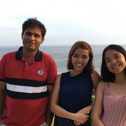 3 members who are apart of Nursing Careers Australia, standing next to each other with land and a sea view behind them